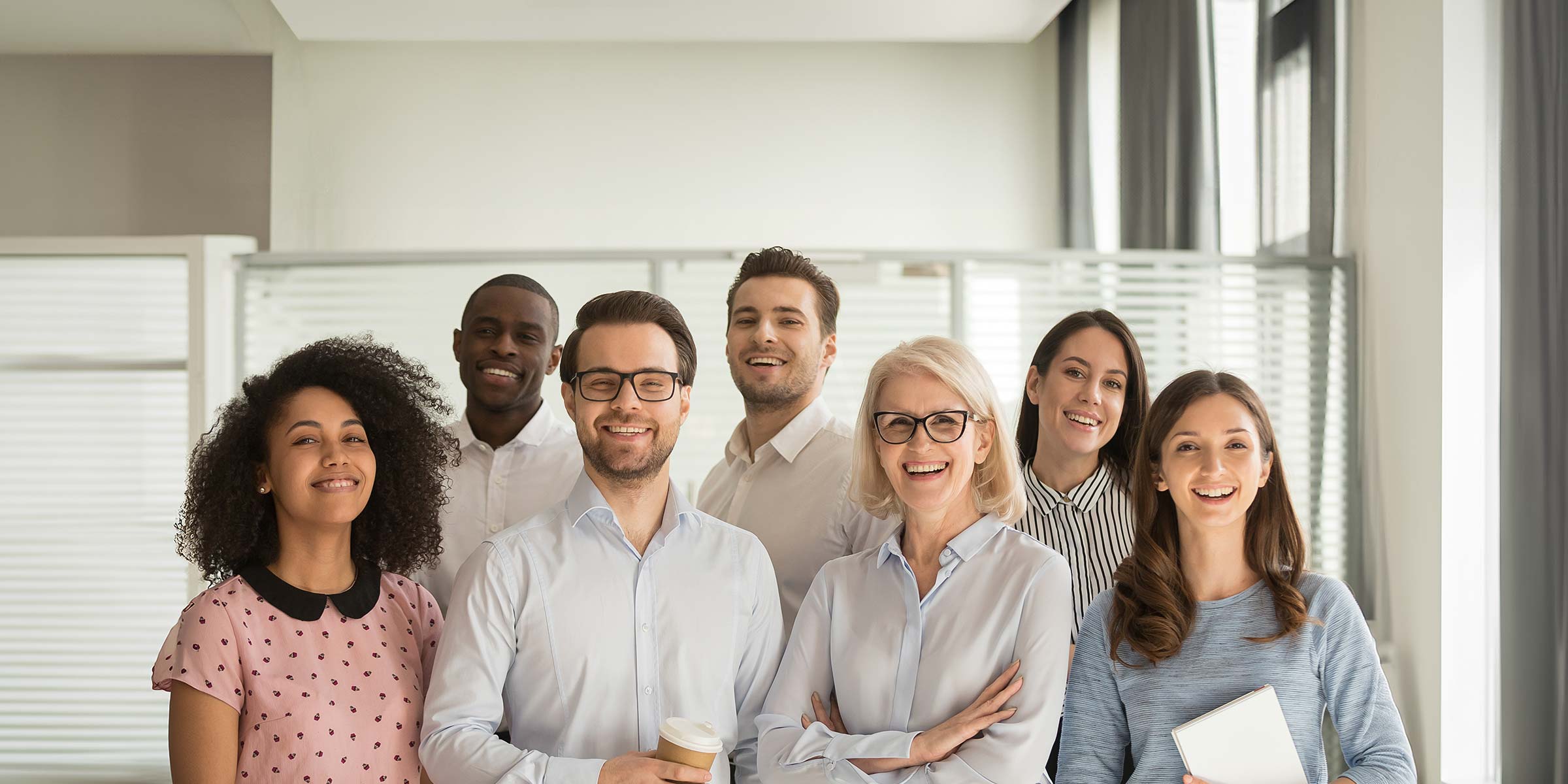 Diverse team of smiling experts at AHP, your sourcing partner for Medical Protective Equipment and Hygiene Products.