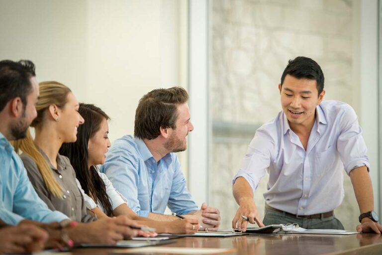 AHP team in strategic meeting discussing sourcing solutions and procurement strategies for global clients